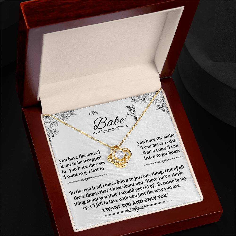 yellow gold love knot necklace in luxury box angled left