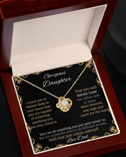 Love Knot Necklace with a yellow gold charm in a mahogany box angle 2