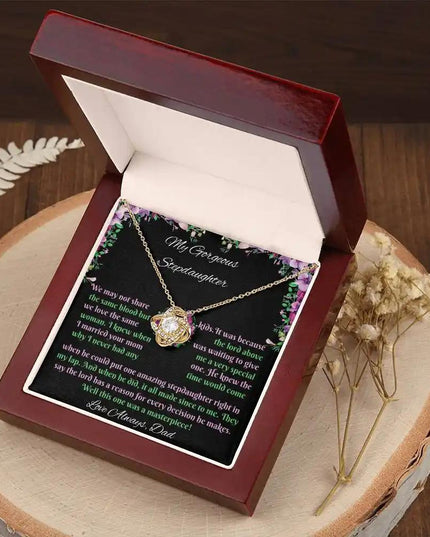 yellow gold love knot necklace mahogany box angled right