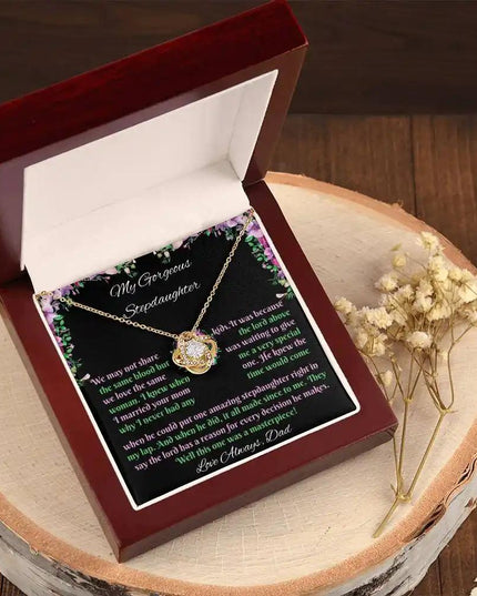 yellow gold love knot necklace mahogany box angled left