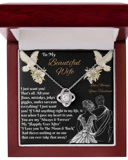 white gold love knot necklace in a mahogany box