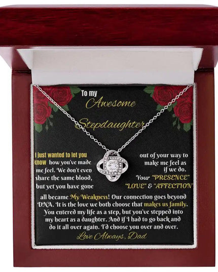white gold love knot necklace in a mahogany box