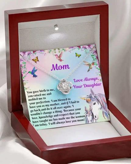 white gold love knot necklace in mahogany box angled left