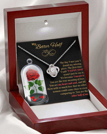 14k white gold love knot necklace in luxury box angled left