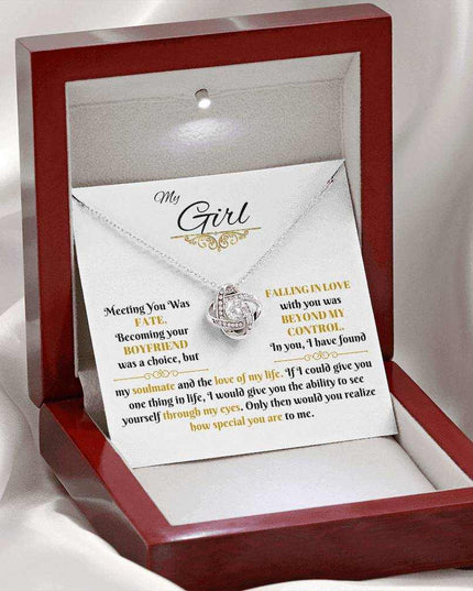 white gold love knot necklace in a luxury box with LED light on