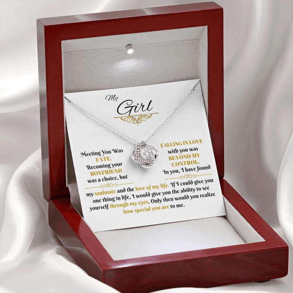 white gold love knot necklace in a luxury box with LED light on