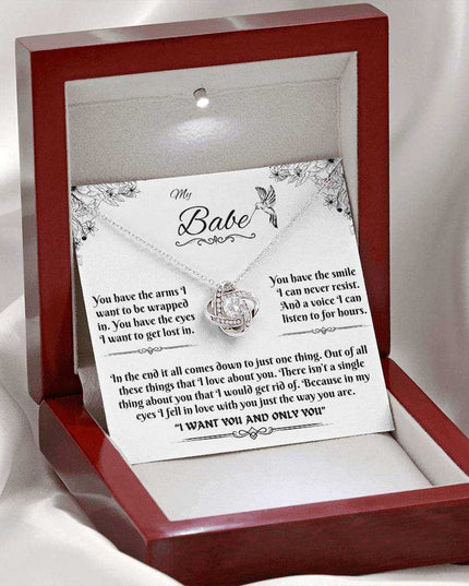 white gold love knot necklace in luxury box with LED light on