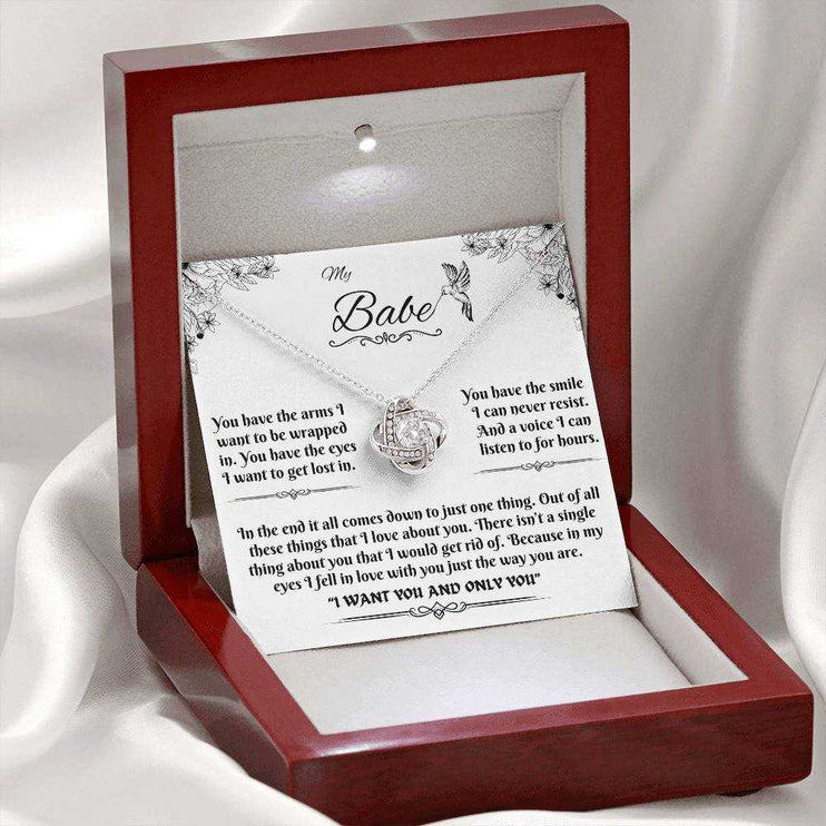 white gold love knot necklace in luxury box with LED light on