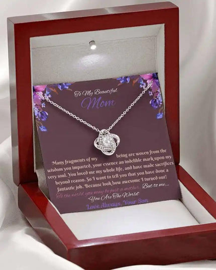 white gold love knot necklace in mahogany box angled left
