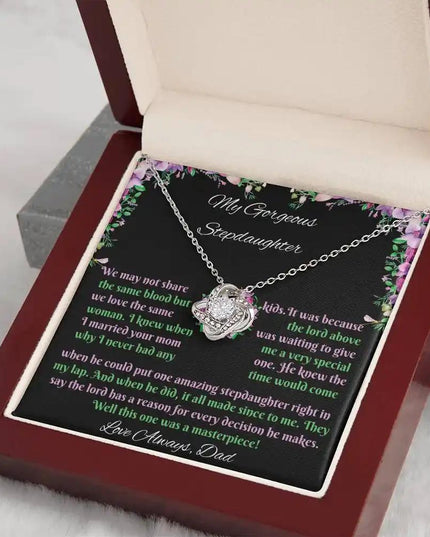 white gold love knot necklace mahogany box angled right