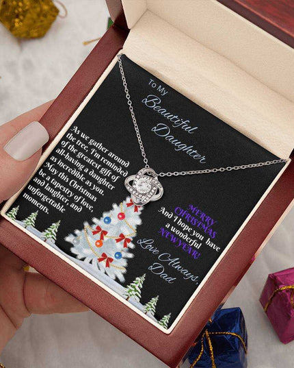 white gold love knot necklace in luxury box in model's hand