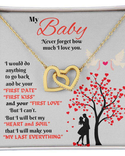 gold interlocking hearts necklace in a soft box up close