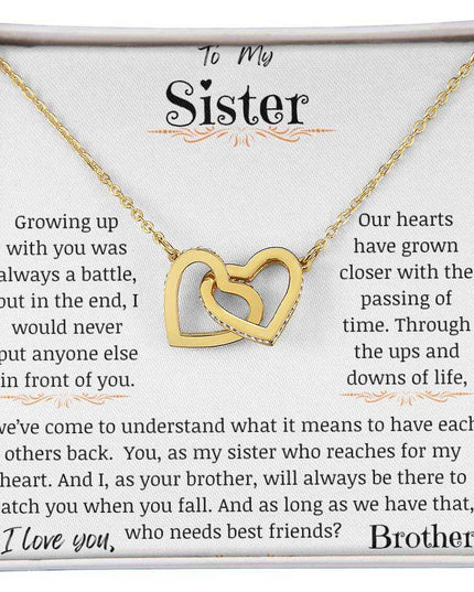 a yellow gold interlocking hearts necklace up close