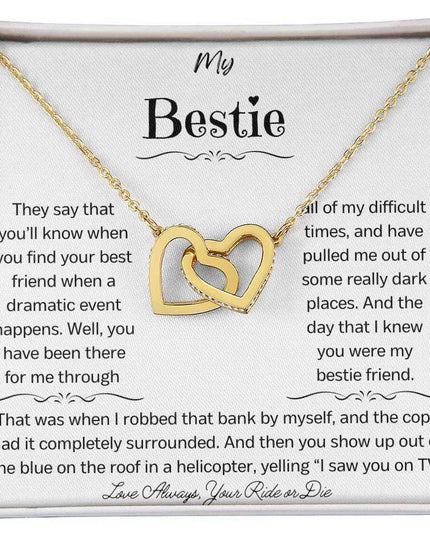 a gold interlocking hearts necklace up close
