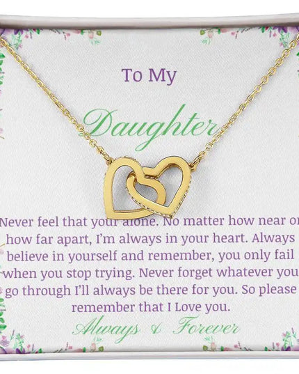 a gold interlocking hearts necklace up close