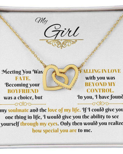 gold interlocking hearts necklace in soft box up close