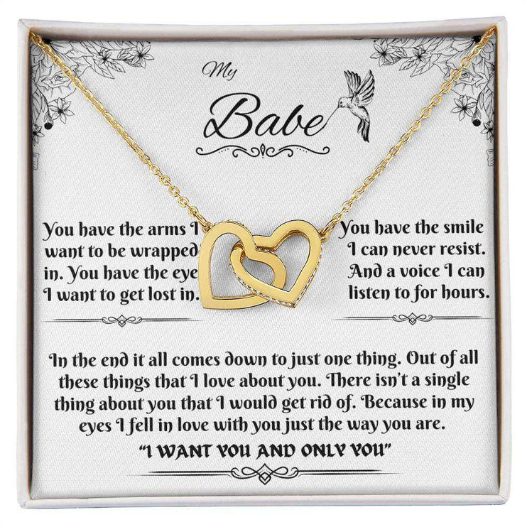 gold interlocking hearts necklace in a soft box up close