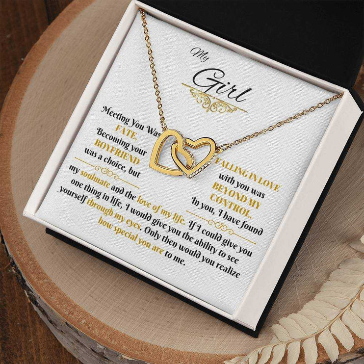 gold interlocking hearts necklace in soft box angled right