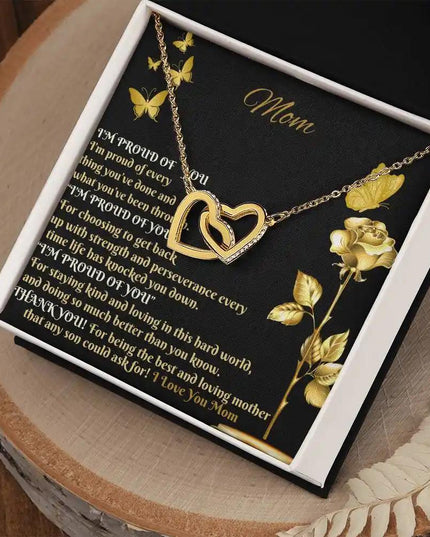 gold interlocking hearts necklace in two-tone box angled right