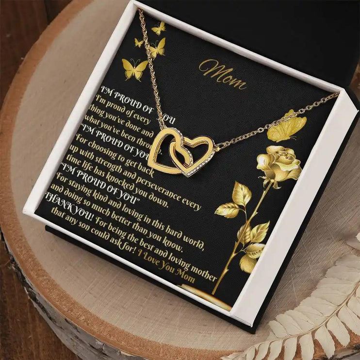 gold interlocking hearts necklace in two-tone box angled right