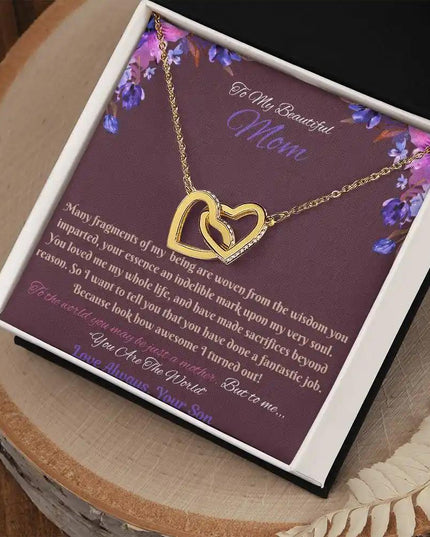 gold interlocking hearts necklace in soft box angled right