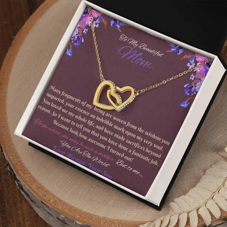 gold interlocking hearts necklace in soft box angled right