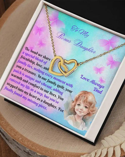 yellow gold interlocking hearts necklace in two-tone box angled right