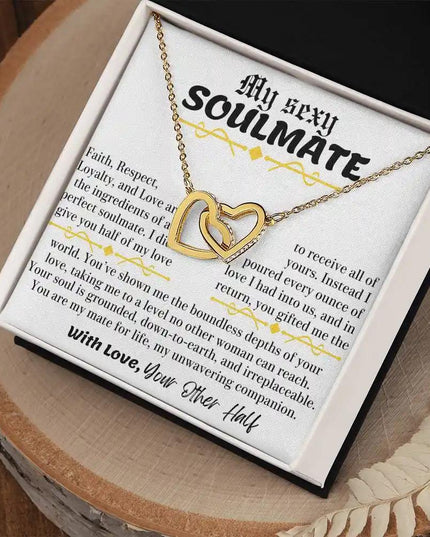 a yellow gold interlocking hearts necklace in a two-tone box angle right