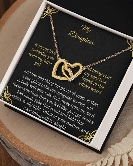 Interlocking Hearts Necklace with a gold charm in a two-tone box angle 2