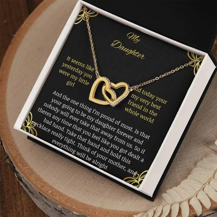 Interlocking Hearts Necklace with a gold charm in a two-tone box angle 2