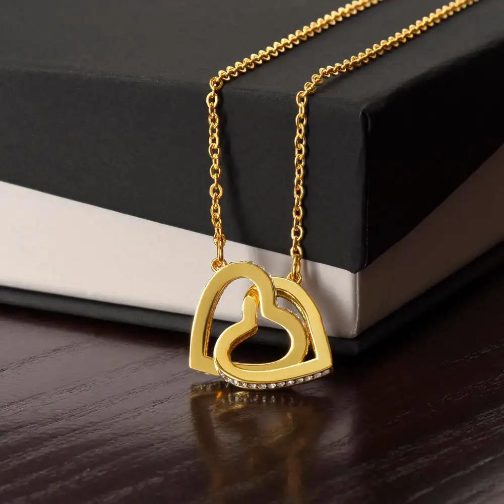 gold interlocking hearts necklace in two-tone box