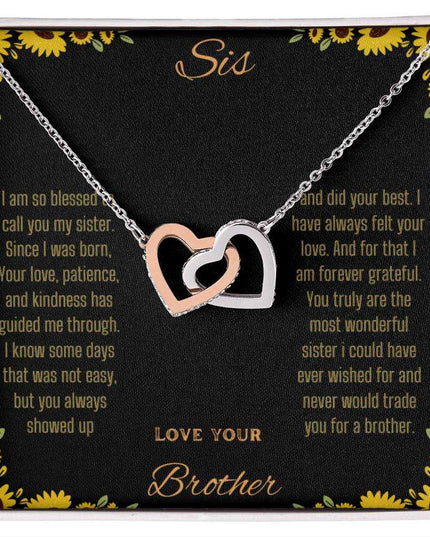 Interlocking Hearts Necklace with rose gold variant on a To Sis from Brother greeting card up close