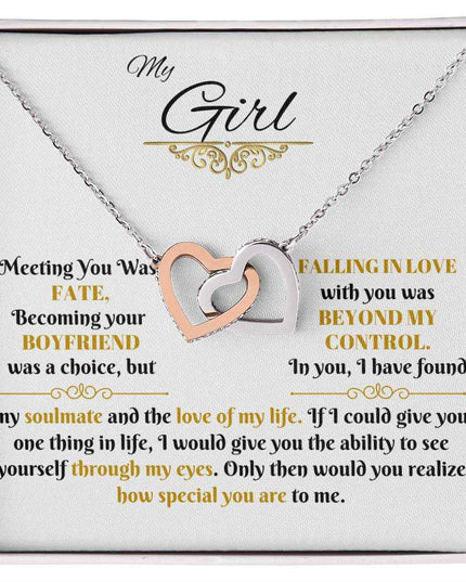 gold interlocking hearts necklace in soft box up close