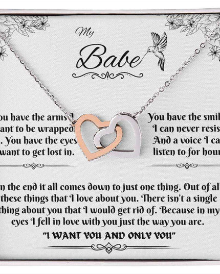 rose gold interlocking hearts necklace in a soft box up close