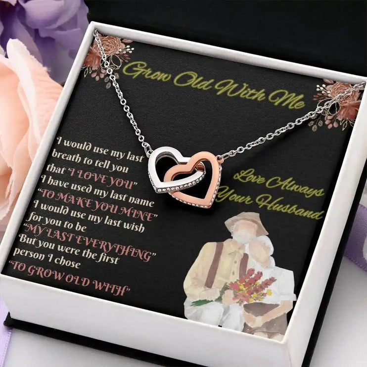 rose gold interlocking hearts necklace in two-tone box angled right