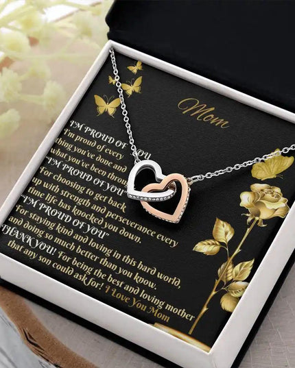 rose gold interlocking hearts necklace in two-tone box angled right