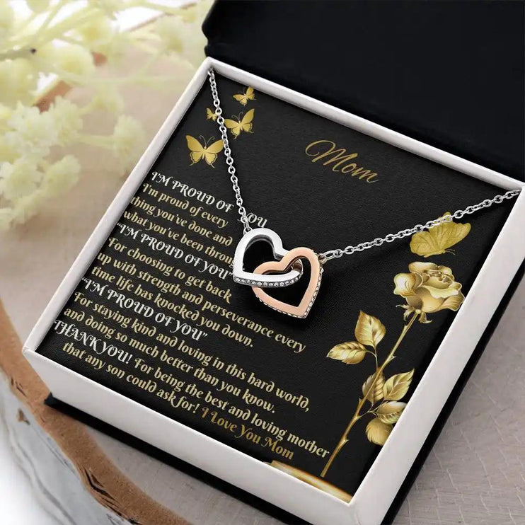 rose gold interlocking hearts necklace in two-tone box angled right