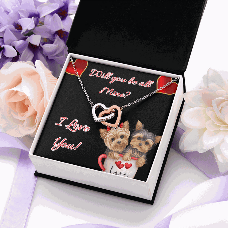 rose gold interlocking hearts necklace in a soft box with flowers