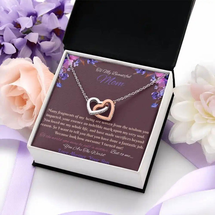 rose gold interlocking hearts necklace in soft box angled right