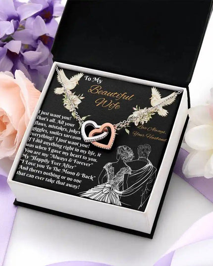 rose gold interlocking hearts necklace in a two-tone box top view