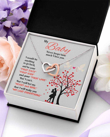 rose gold interlocking hearts necklace in a soft box with flowers