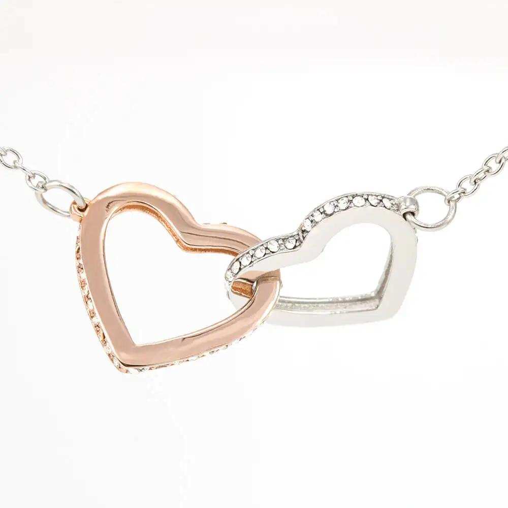 rose gold interlocking hearts necklace up close of charm