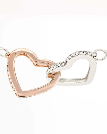 rose gold interlocking hearts necklace showing charm up close