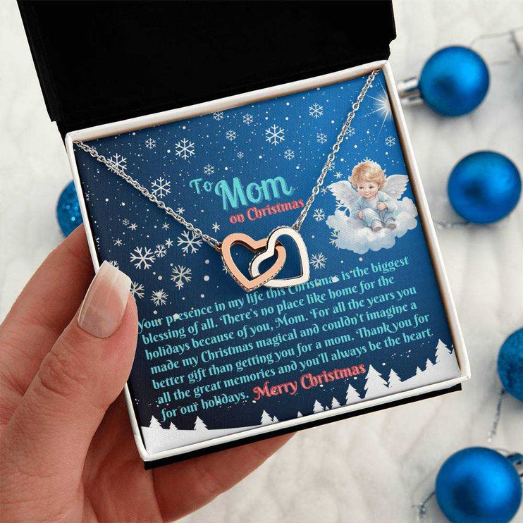 rose gold interlocking hearts necklace in soft box in model's hand