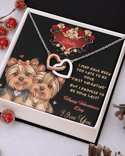 rose gold interlocking hearts necklace in a soft box angled to the right