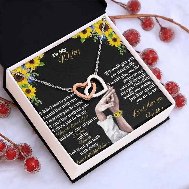 rose gold interlocking hearts necklace in two-tone box angled left