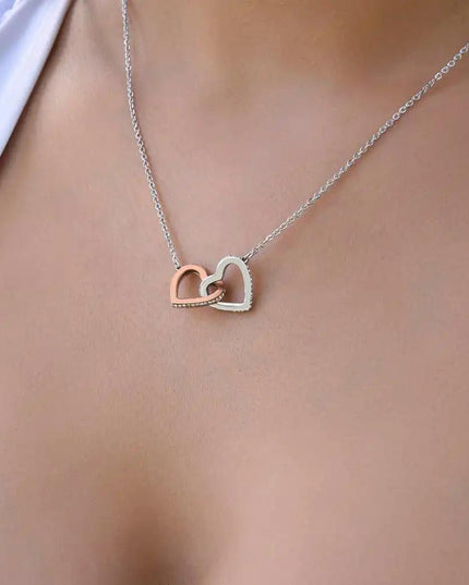 rose gold interlocking hearts necklace on model's neck