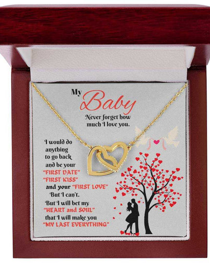 gold interlocking hearts necklace in luxury box up close