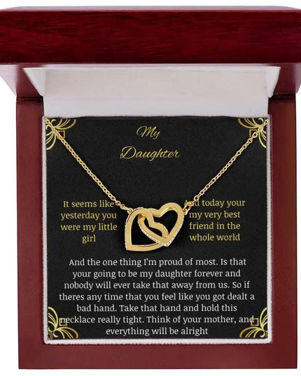 Interlocking Hearts Necklace with a gold charm in a mahogany box angle 1