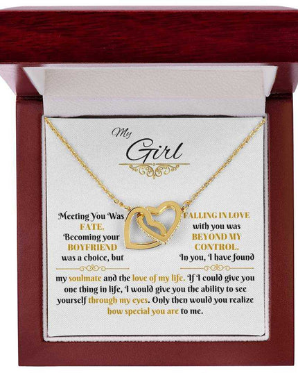gold interlocking hearts necklace in a luxury box up close